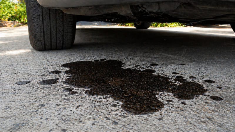 Oil spill under parked car